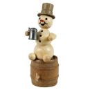 Schneemann Junior mit Krug auf Fass